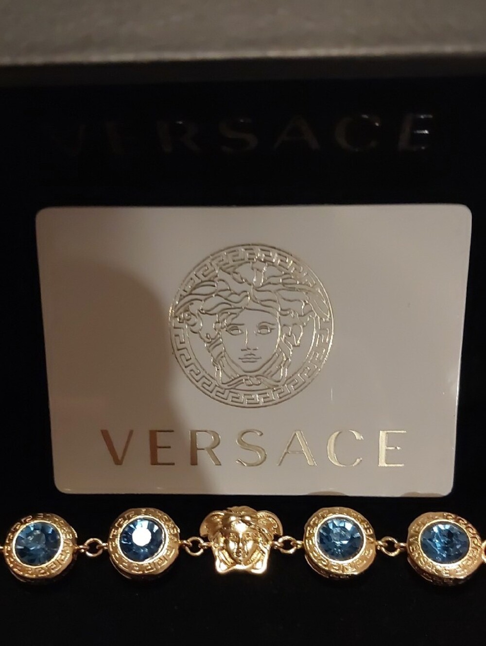 Versace Gold Bracelet with Blue Crystals Medusa Charm Authentic